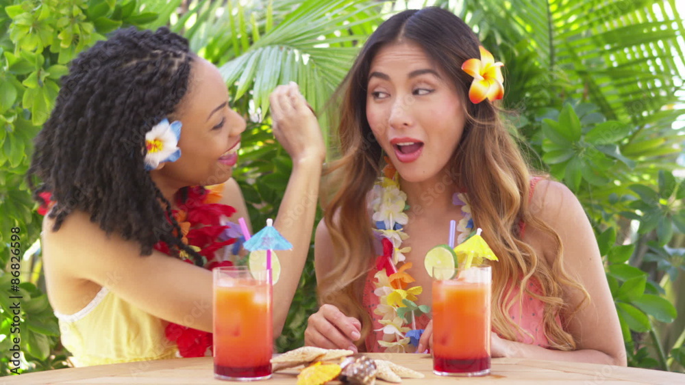 Black and Asian woman friends laughing and being funny on vacation Black and Asian woman friends laughing and being funny on vacation
