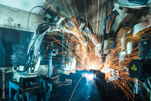 robots welding in a car factory
