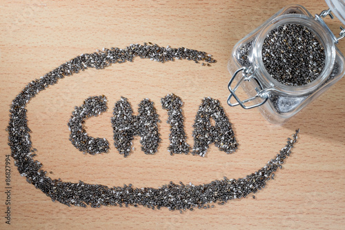 chia word made from chia seeds on wooden plate