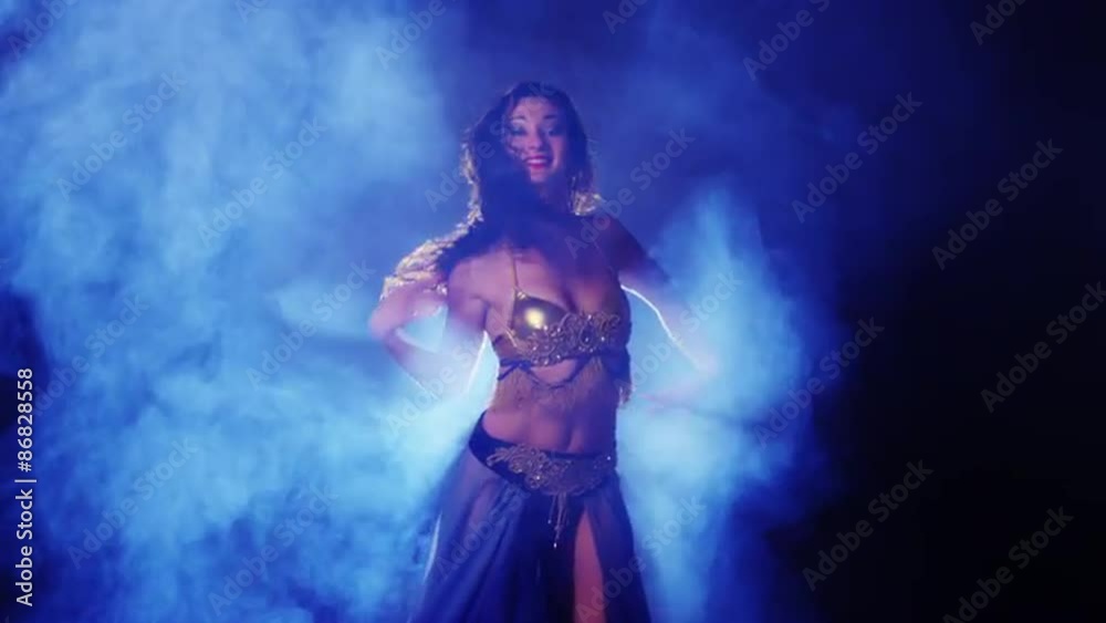 Sexy mixed race woman belly dancing in studio Sexy mixed race woman belly dancing in studio