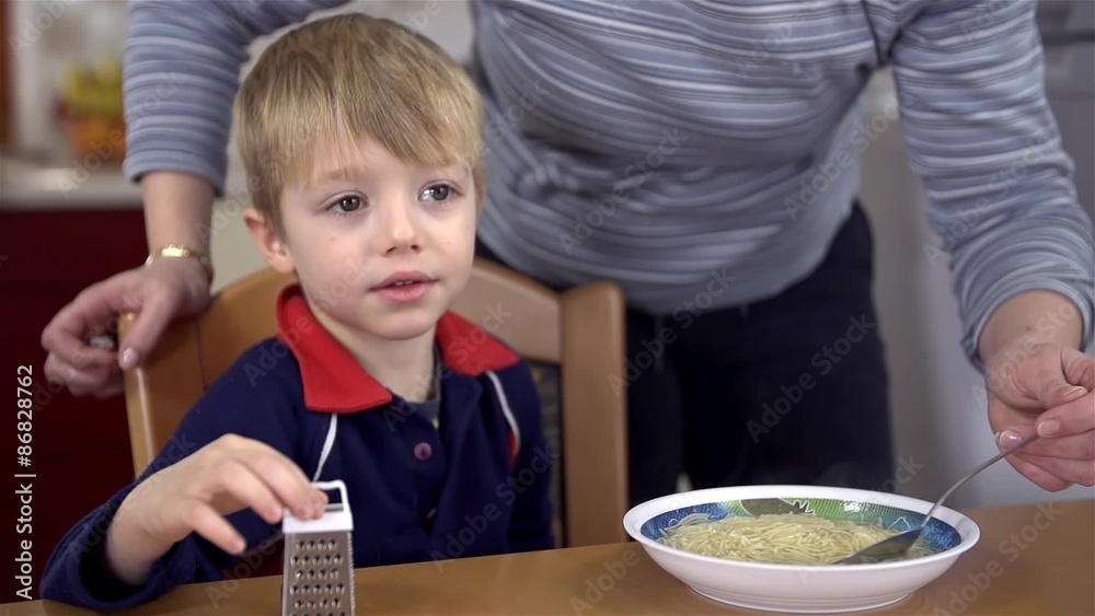 Mother cooling son's soup Mother cooling son's soup