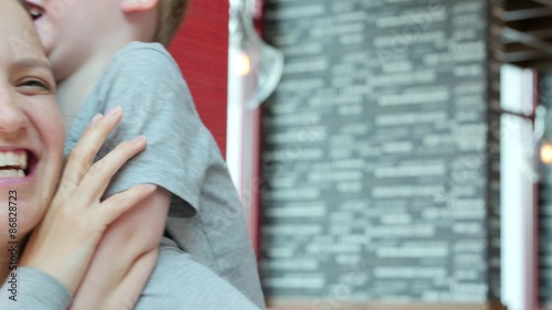 Mother and boy at fast food restaurant photo