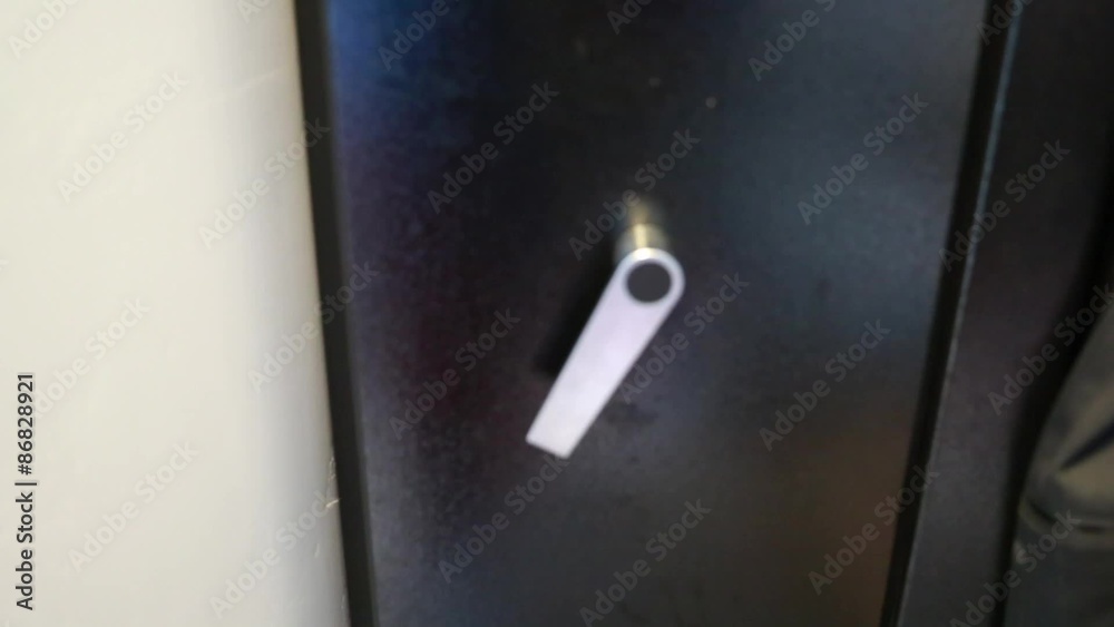 a man closes a gun safe