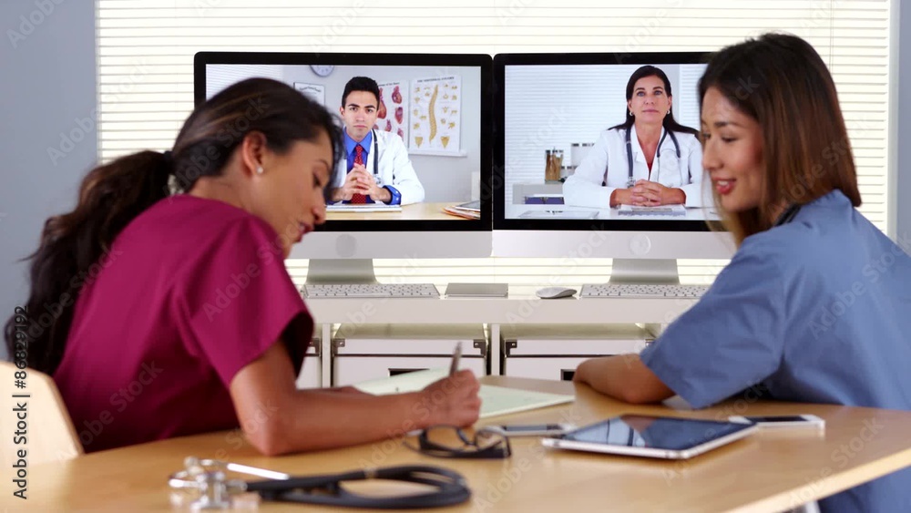 Diverse group of doctors having a video conference Diverse group of doctors having a video conference
