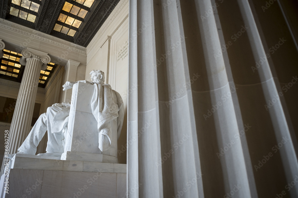 Interior view of the Lincoln Memorial in Washington DC with an imposing fluted column in the foreground