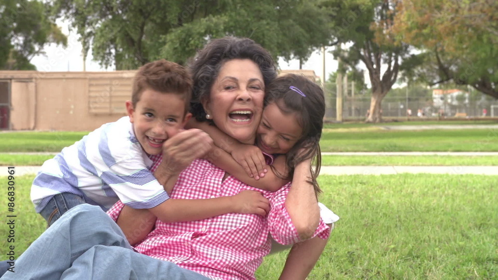 Slow Motion Shot Of Grandmother With Grandchildren In Park Slow Motion Shot Of Grandmother With Grandchildren In Park