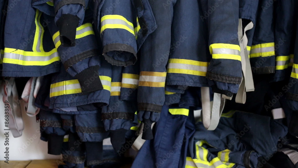 Focus on fireman clothes hanging Focus on fireman clothes hanging