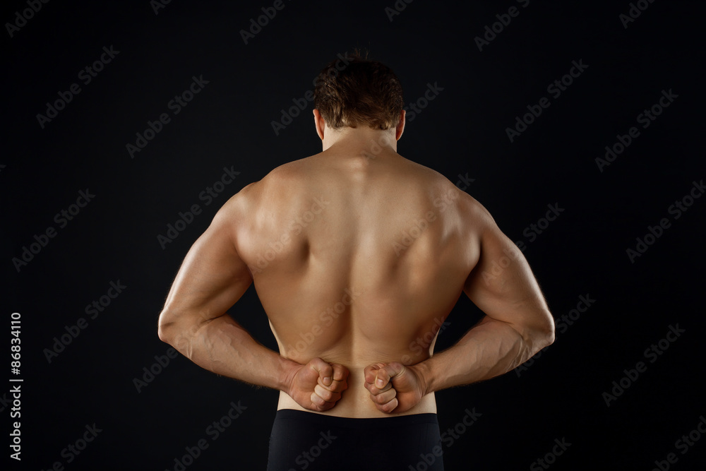 Attractive young bodybuilder is presenting his perfect body Attractive young bodybuilder is presenting his perfect body