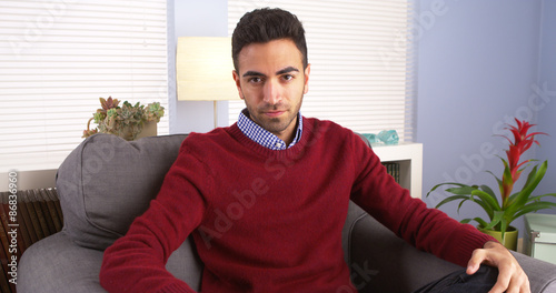 Tableau sur toile Suave Puerto Rican man sitting in living room