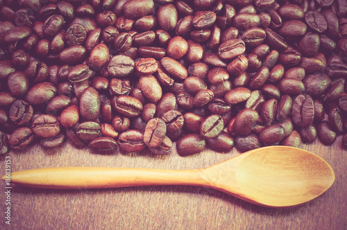 Coffee beans and wooden spoon with filter effect retro vintage s