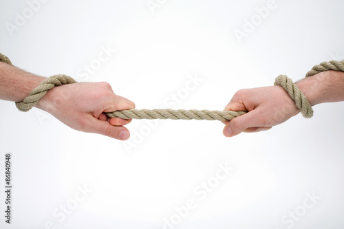  Two hands holding and pulling the rope 