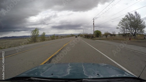 Car driving on roads in central Utah photo