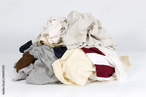 Pile of old clothes on white background