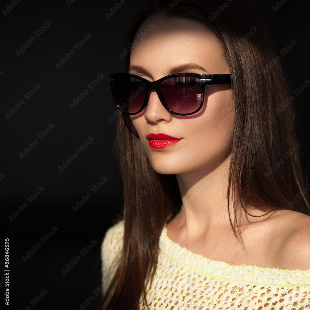 Beautiful young model with sunglasses.