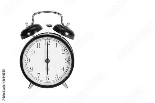 Six O' Clock on alarm clock isolated on white