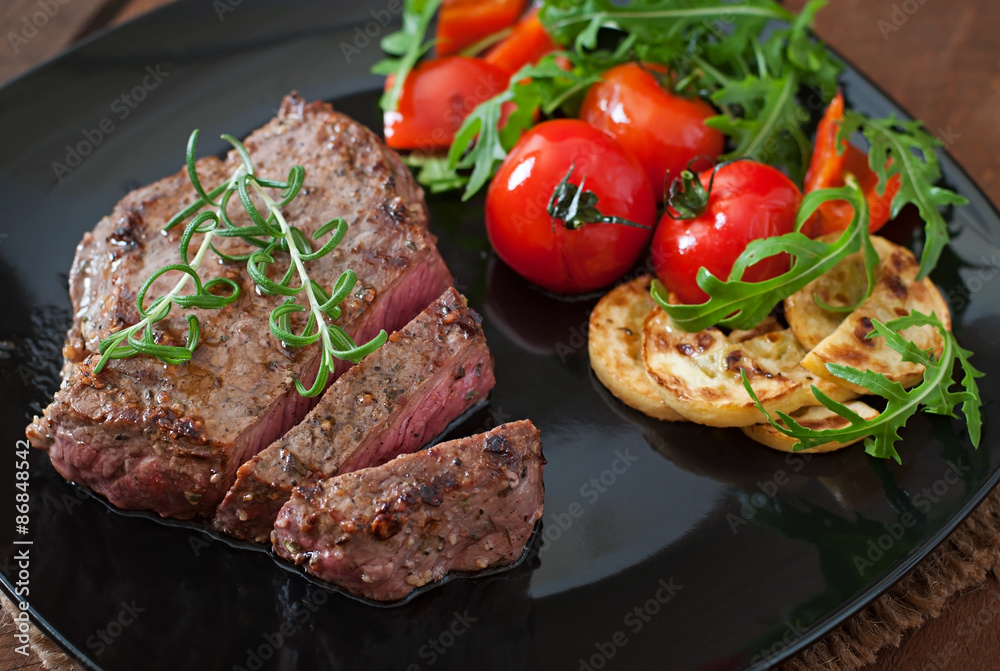 Closeup of grilled beef steak with vegetables Closeup of grilled beef steak with vegetables