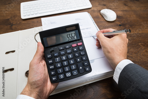 Businessperson Calculating Financial Result