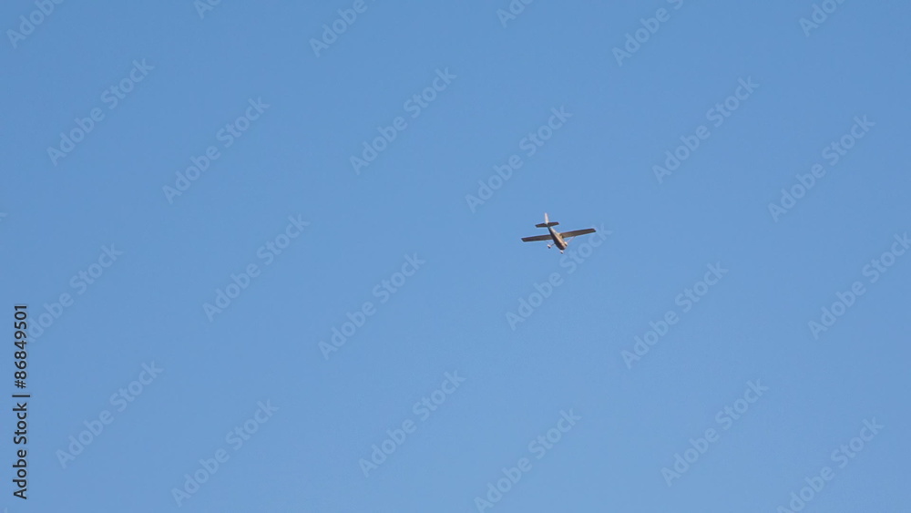 Fast airplane flying over on blue sky Fast airplane flying over on blue sky