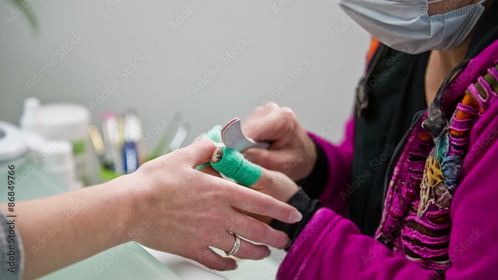 Brushing away nail particles after file close up