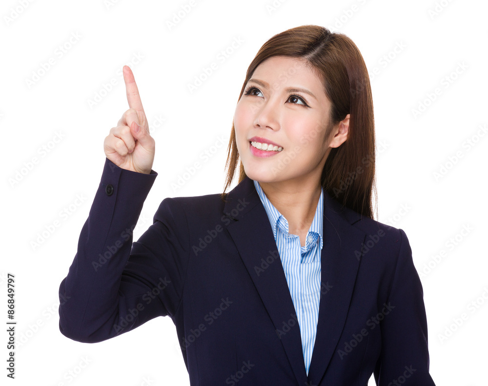 Young businesswoman look at the finger touch on the imaginary pa Young businesswoman look at the finger touch on the imaginary pa
