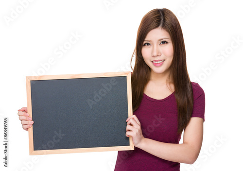 Asian woman showing with blank blackboard