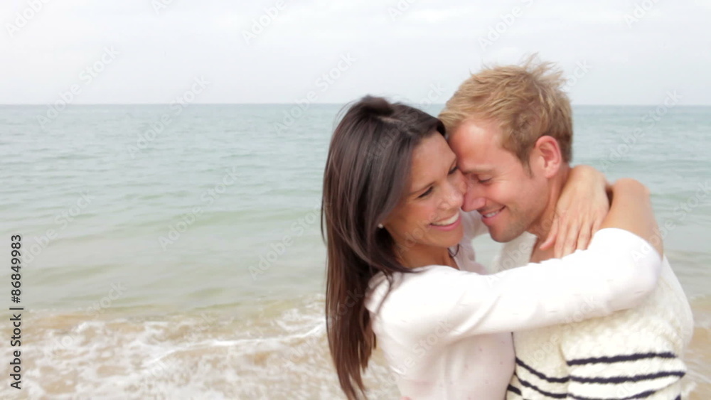 Romantic Couple Hugging And Kissing On Beach Together Romantic Couple Hugging And Kissing On Beach Together