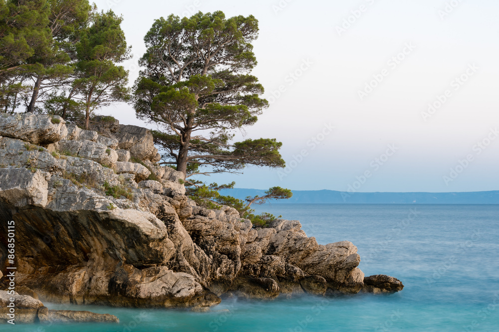 Small stone island in Adriatic sea, Brela, Dalmatia, Croatia. Small stone island in Adriatic sea, Brela, Dalmatia, Croatia.