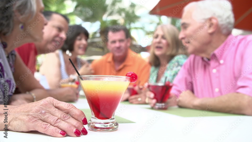 Group Of Senior Friends Enjoying Cocktails In Bar Together Group Of Senior Friends Enjoying Cocktails In Bar Together