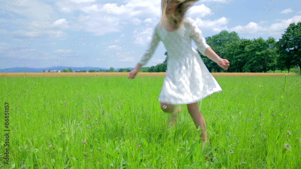 Girl Jumping Around on Grass With Beautiful Landscape