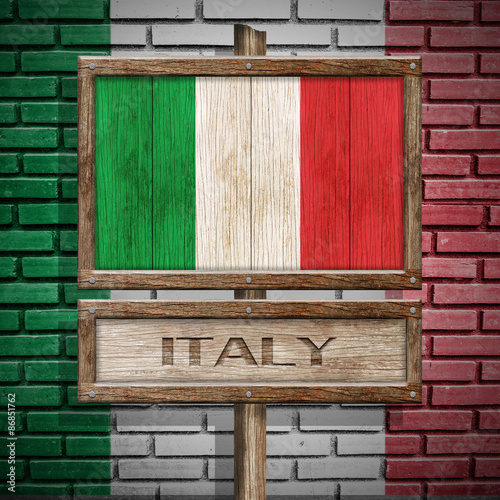 Italy flag wooden sign with brickwall background