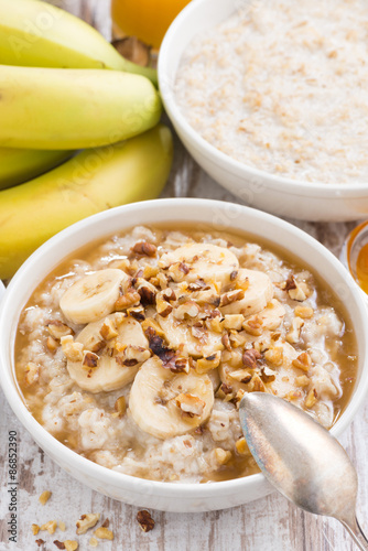 healthy breakfast - oatmeal with banana, honey and walnuts