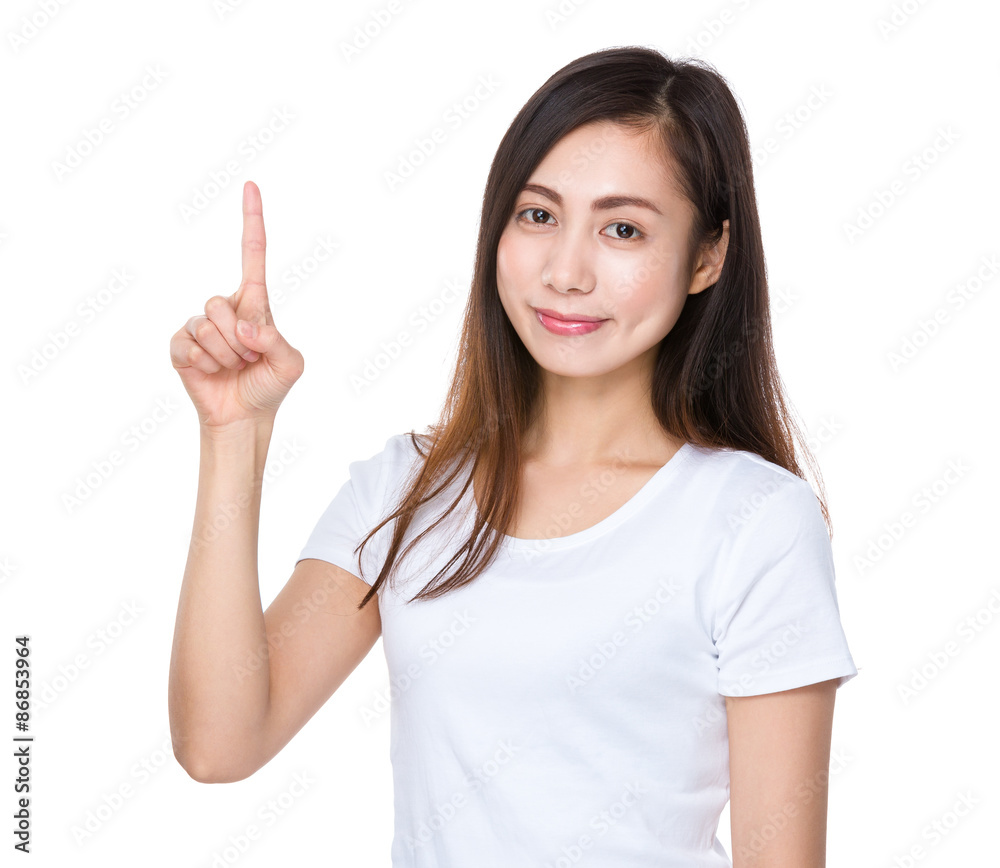 Young woman showing with finger point up Young woman showing with finger point up