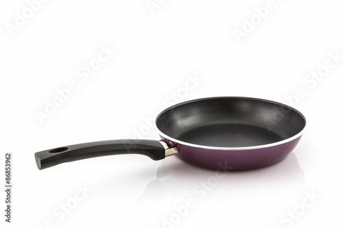 Black frying pan with handle.