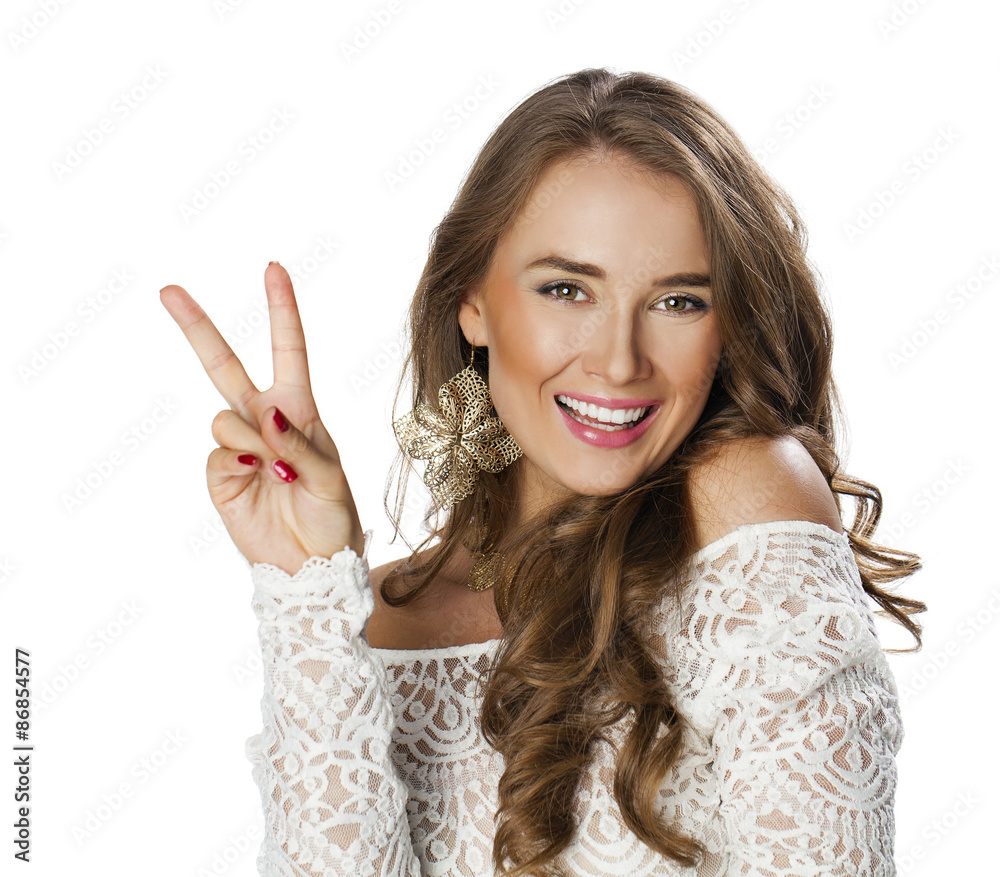 Young smiling brunette woman showing victory or peace sign Young smiling brunette woman showing victory or peace sign