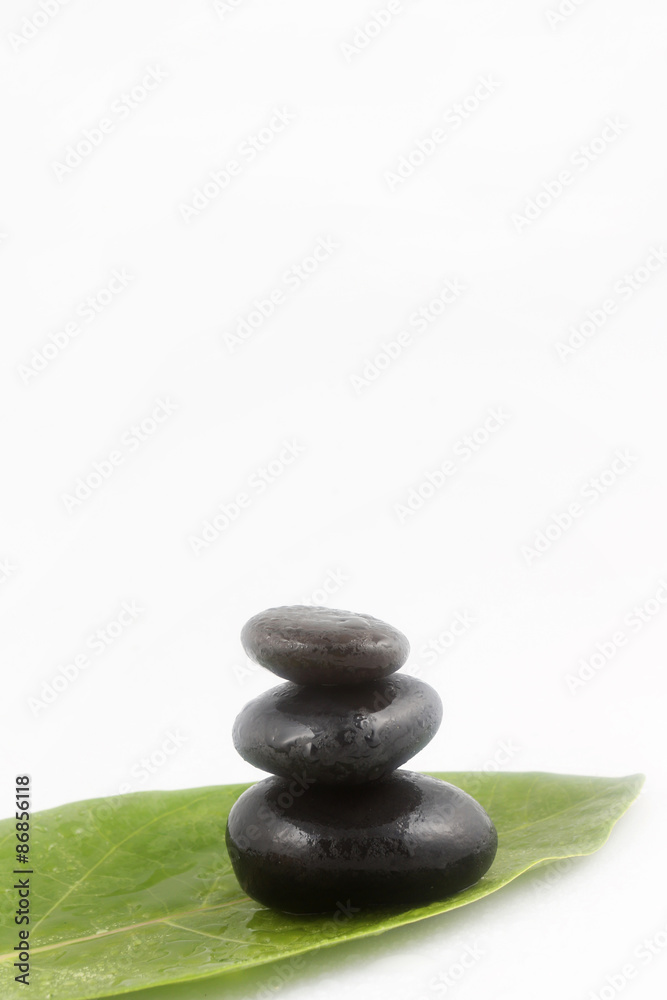 Balanced black zen stones on white background
Balanced black zen stones on white background