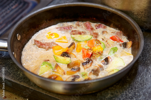 Meat and vegetables cooked in cream