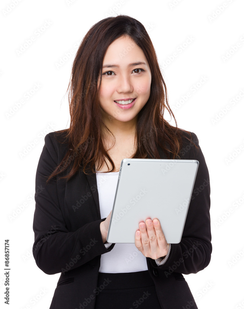 Asian businesswoman use of the tablet pc Asian businesswoman use of the tablet pc