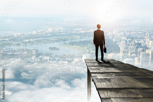 businessman standing on pie