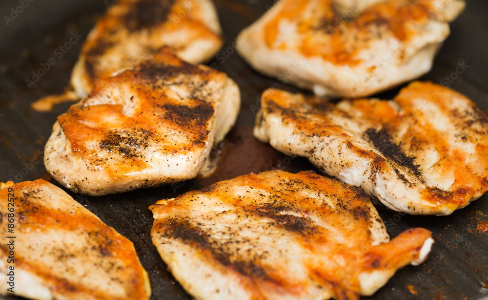 Close-up of grilled chicken breast with spices