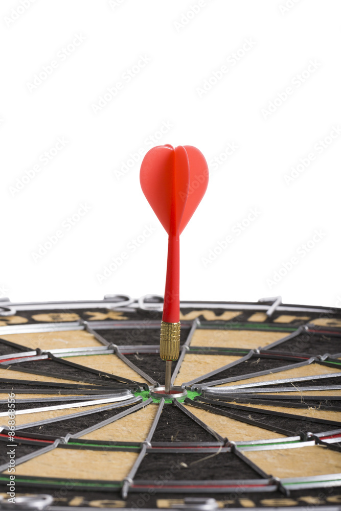 Red Dart hitting the middle of dartboard Red Dart hitting the middle of dartboard