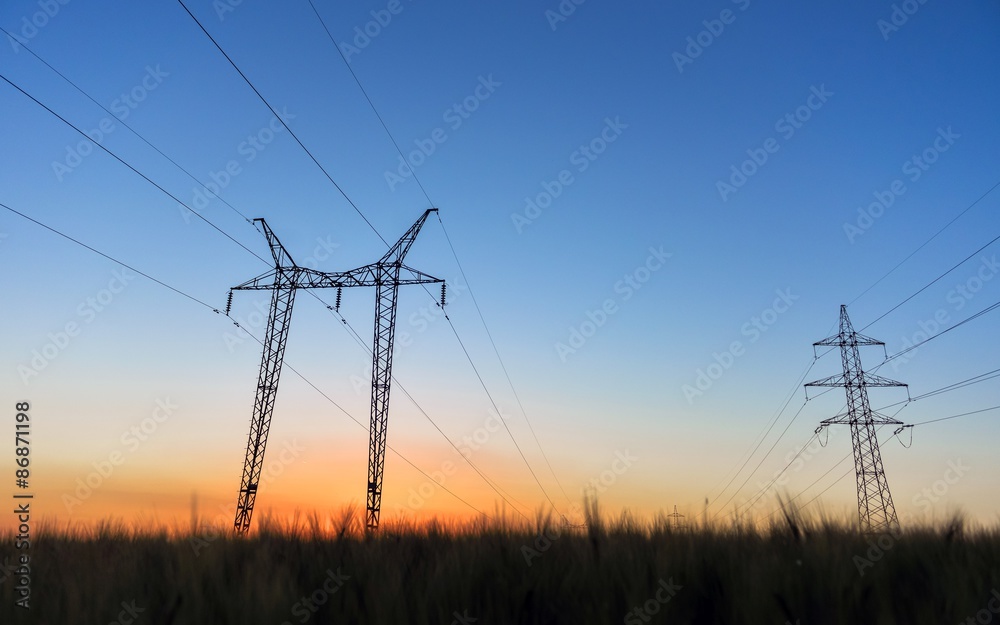 Large transmission towers at blue hour 