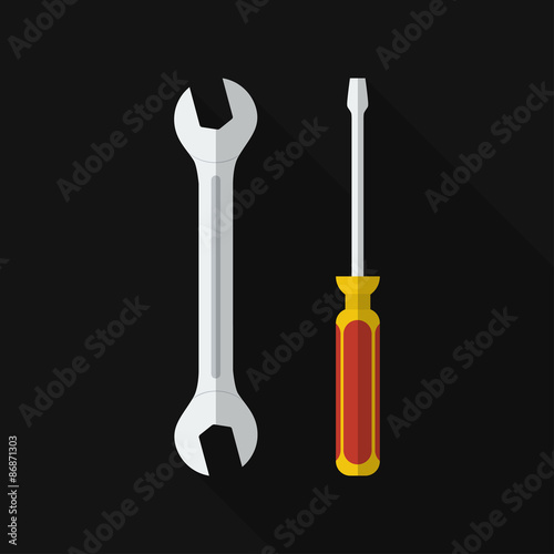Flat screwdriver, wrench with long shadow