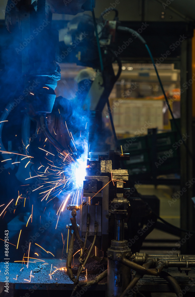robots welding in a car factory robots welding in a car factory