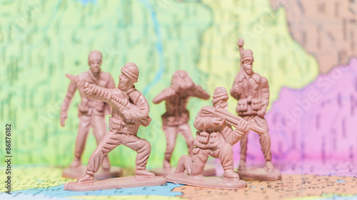 Toy Soldiers on paper map background