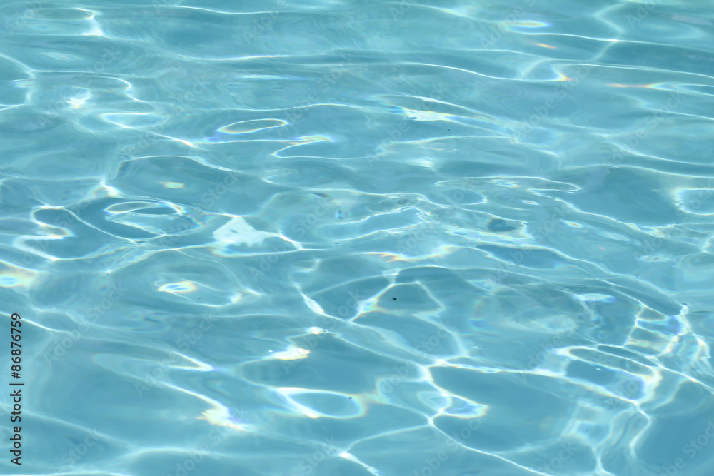 Blue pool water with sun reflections Blue pool water with sun reflections
