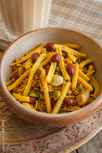 Chiwda or Bombay mix a spicy blend of fried noodles nuts and peas photo