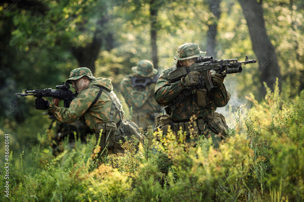 Group of soldiers special forces during the raid in the forest