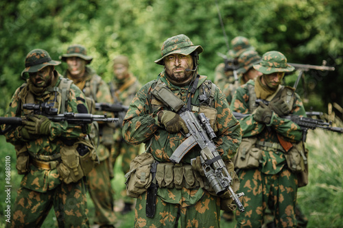 Group of soldiers special forces during the raid in the forest