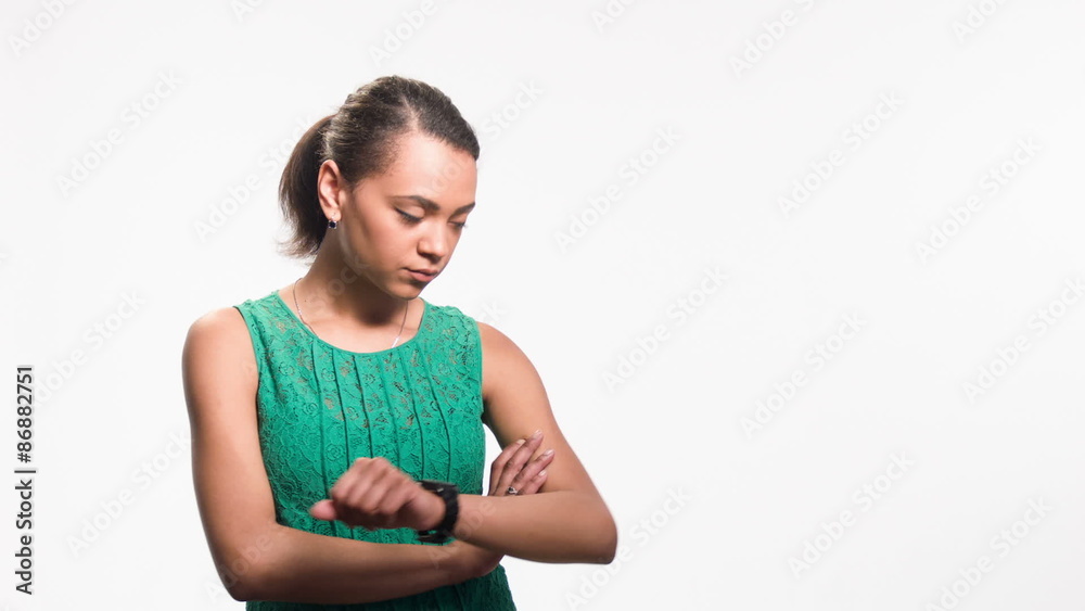 young black woman looking at her watch and experiencing young black woman looking at her watch and experiencing