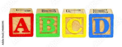A B C D wooden toy letter blocks isolated on white photo